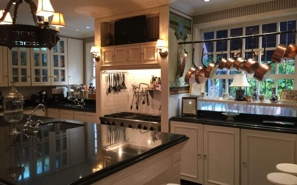 Warm shared kitchen and common table inside the Sofound Mansion