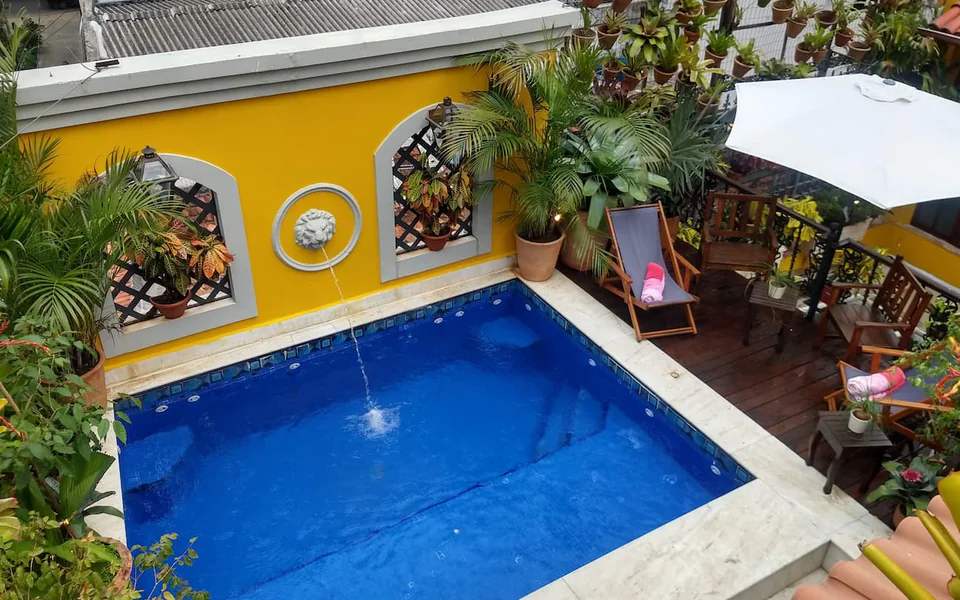 Pool and shaded courtyard at the Sofound Mansion in Rio