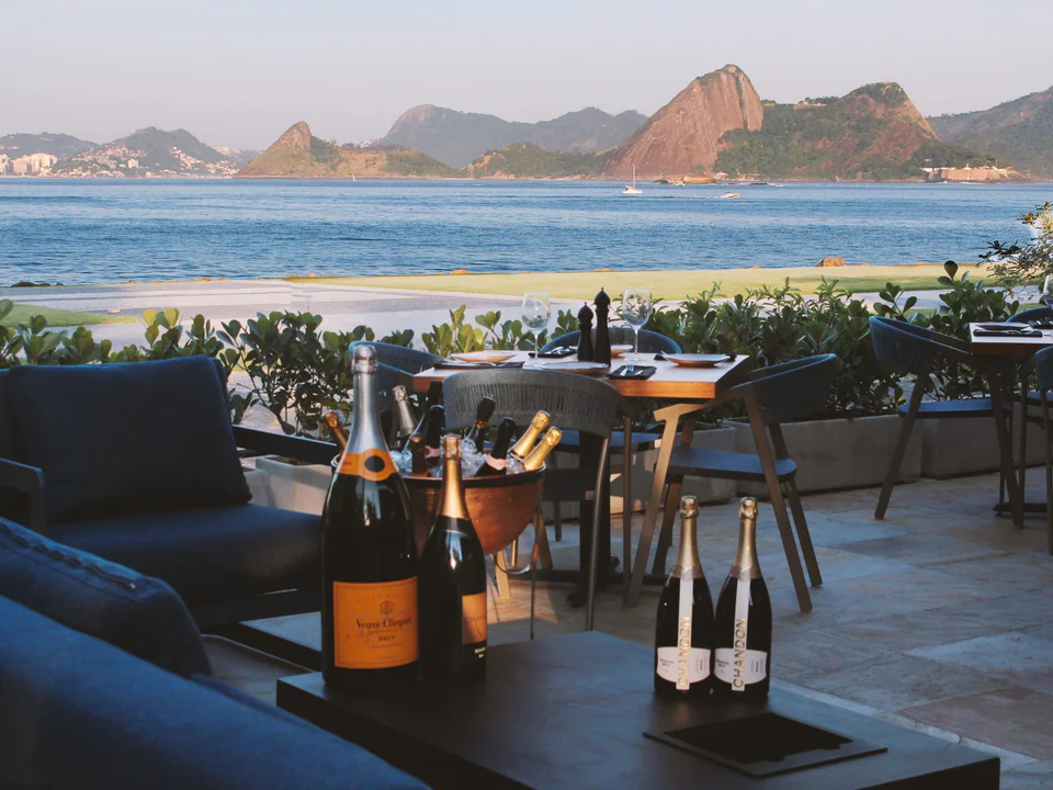 A waterfront dinner setting prepared for a final Rio celebration